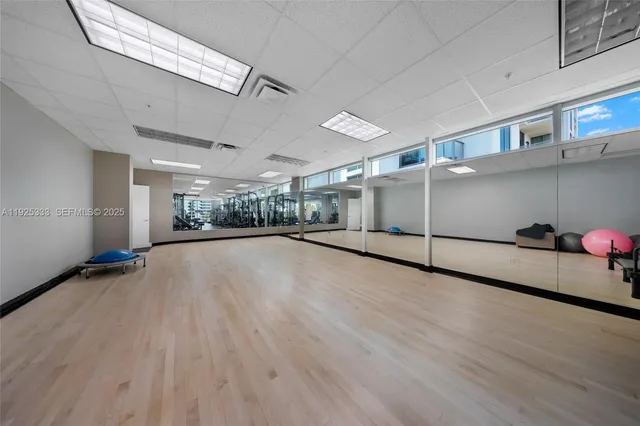 a view of outdoor space with swimming pool and brick wall