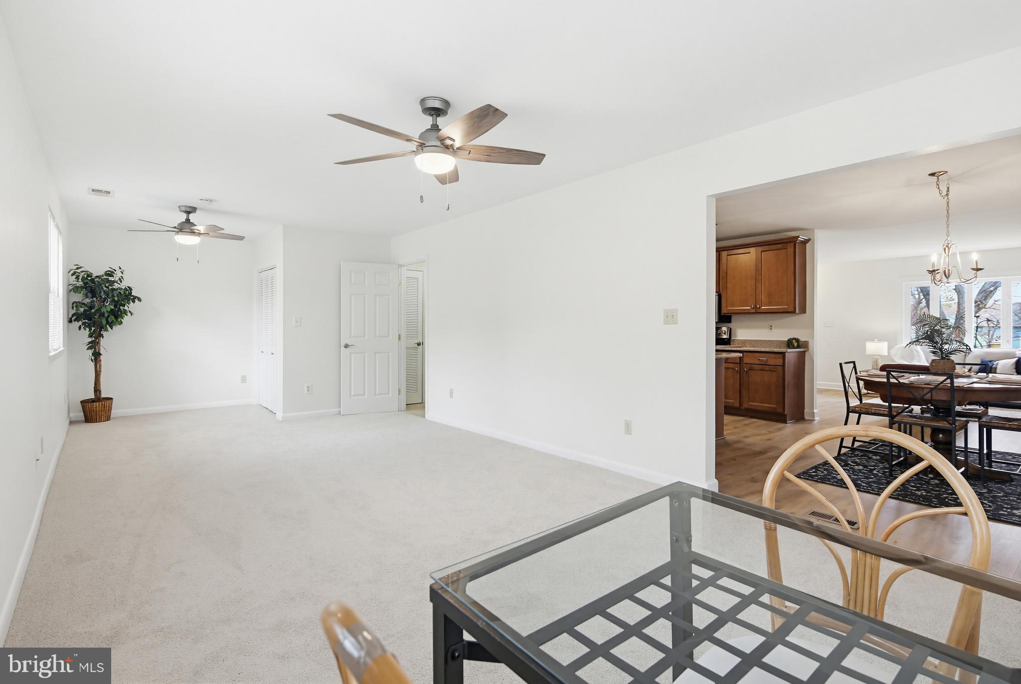 955 Truro Lane Crofton, MD 21114 - Photo 12 of 36 New carpet and ceiling fans in family room