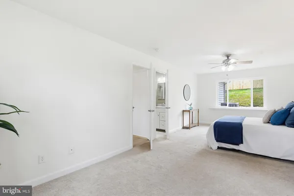 a view of a house with pool and chairs