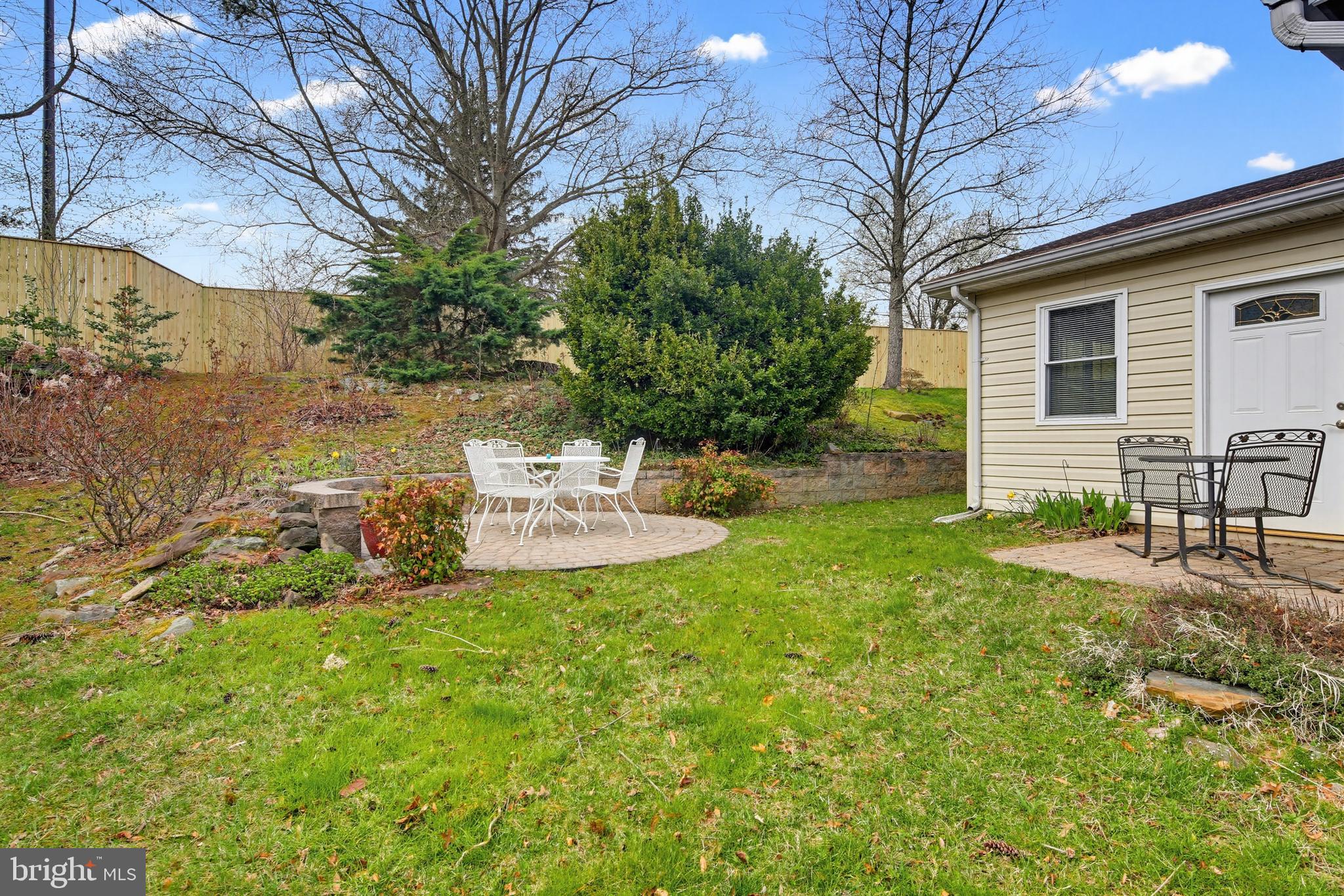 955 Truro Lane Crofton, MD 21114 - Photo 31 of 36 Stone retaining wall creates a tiered backyard