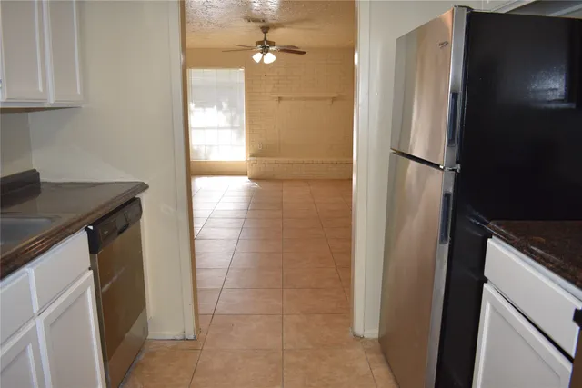 a bathroom with a shower and a sink