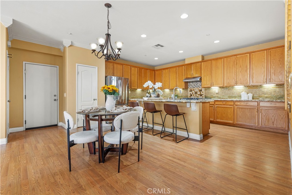 11450 Church Street, Unit 23 Rancho Cucamonga, CA 91730 - Photo 13 of 44 a large kitchen with a table and chairs