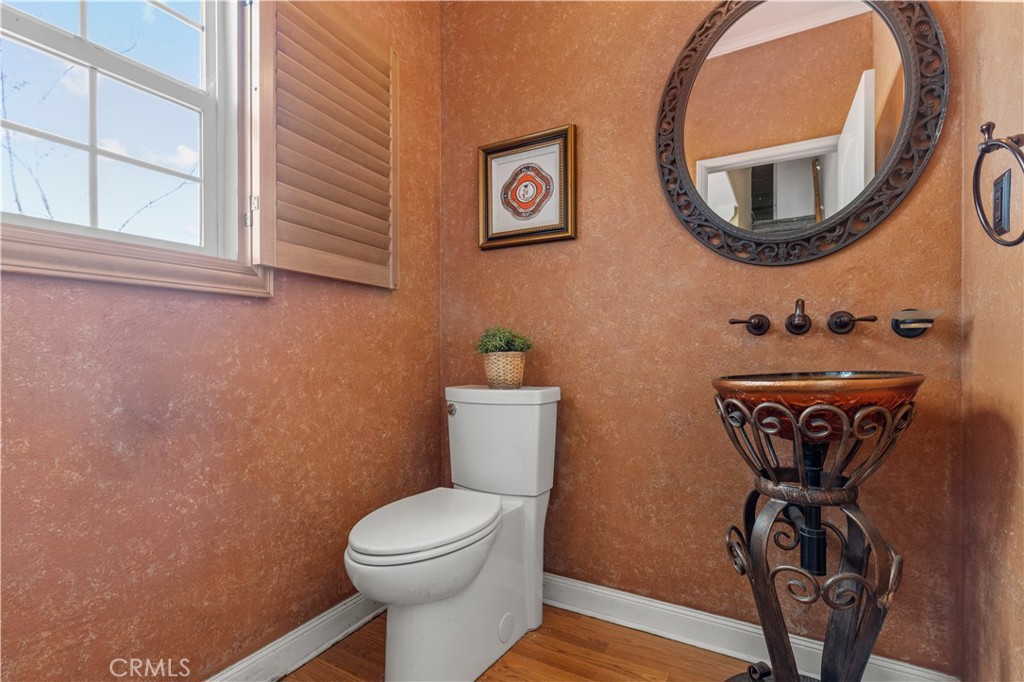 11450 Church Street, Unit 23 Rancho Cucamonga, CA 91730 - Photo 19 of 44 a bathroom with a toilet and a mirror
