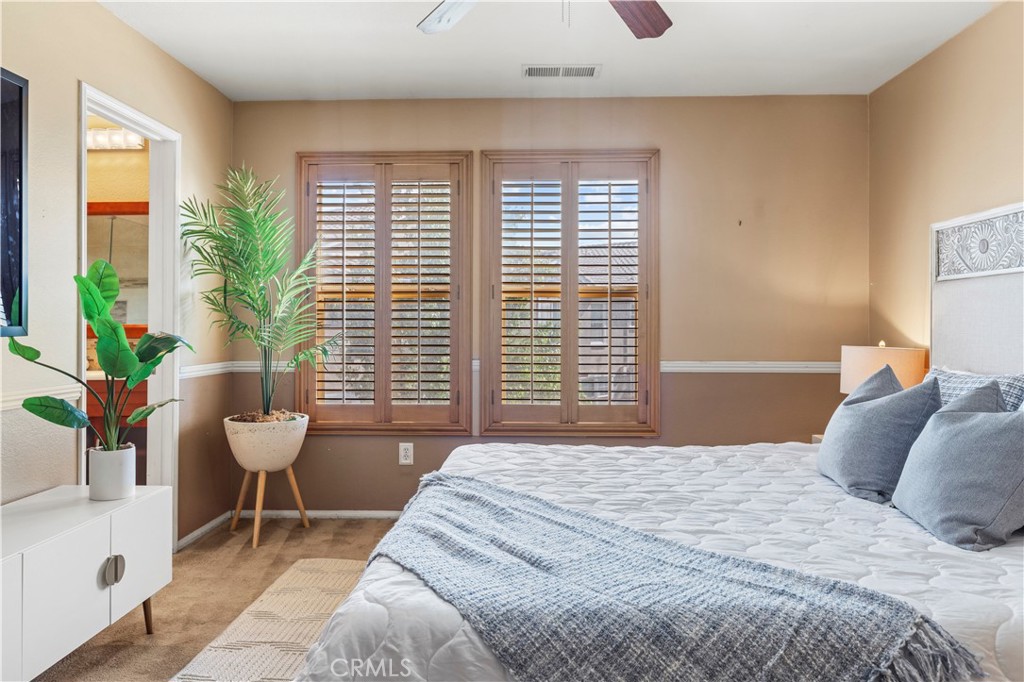 11450 Church Street, Unit 23 Rancho Cucamonga, CA 91730 - Photo 29 of 44 a bedroom with a bed and a window