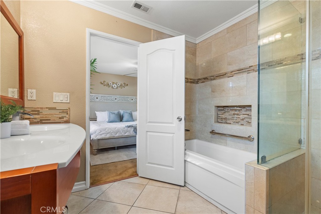 11450 Church Street, Unit 23 Rancho Cucamonga, CA 91730 - Photo 33 of 44 a bathroom with a bathtub and a sink