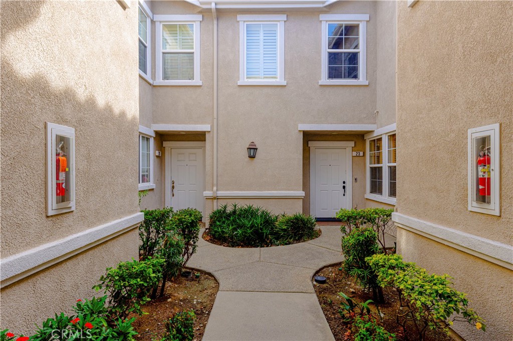 11450 Church Street, Unit 23 Rancho Cucamonga, CA 91730 - Photo 36 of 44 a front view of a house with lots of flowers