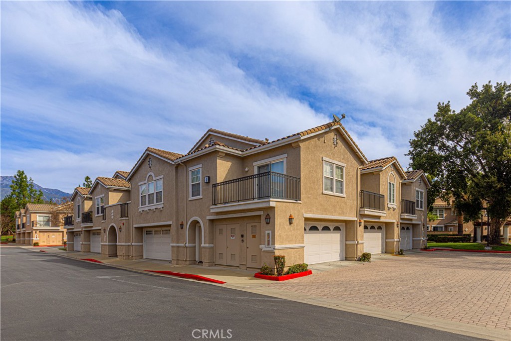 11450 Church Street, Unit 23 Rancho Cucamonga, CA 91730 - Photo 37 of 44 a front view of a house with a street