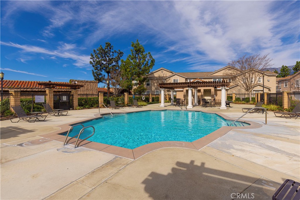 11450 Church Street, Unit 23 Rancho Cucamonga, CA 91730 - Photo 39 of 44 front view of a house with a swimming pool