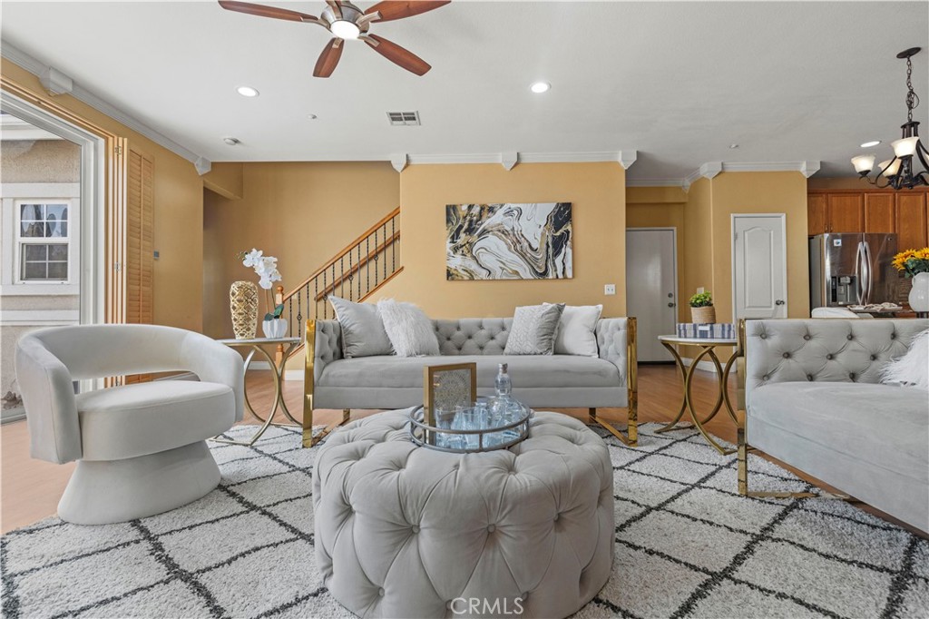 11450 Church Street, Unit 23 Rancho Cucamonga, CA 91730 - Photo 4 of 44 a living room with furniture and a large window