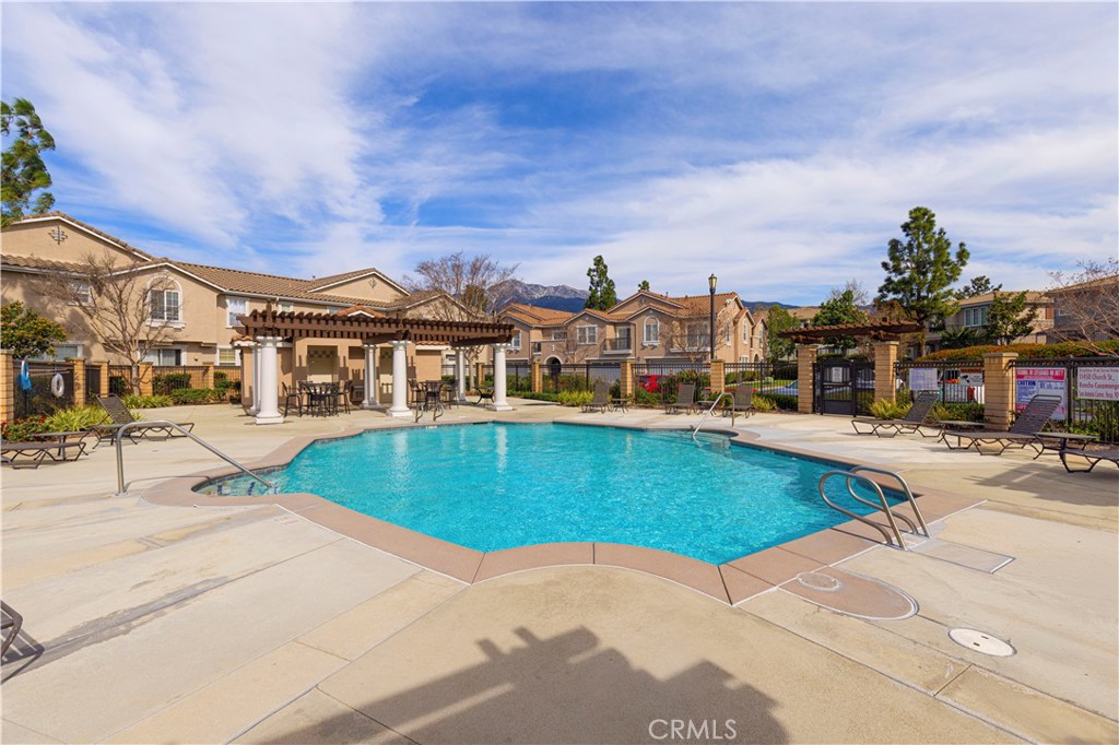 11450 Church Street, Unit 23 Rancho Cucamonga, CA 91730 - Photo 41 of 44 an aerial view of a house with swimming pool and seating space