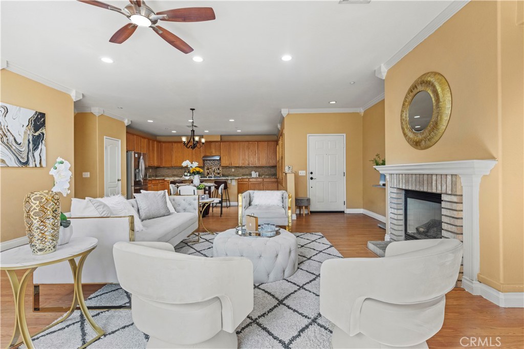 11450 Church Street, Unit 23 Rancho Cucamonga, CA 91730 - Photo 6 of 44 a living room with fireplace furniture and a fireplace
