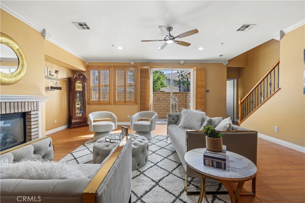11450 Church Street, Unit 23 Rancho Cucamonga, CA 91730 - Photo 9 of 44 a living room with furniture and a fireplace