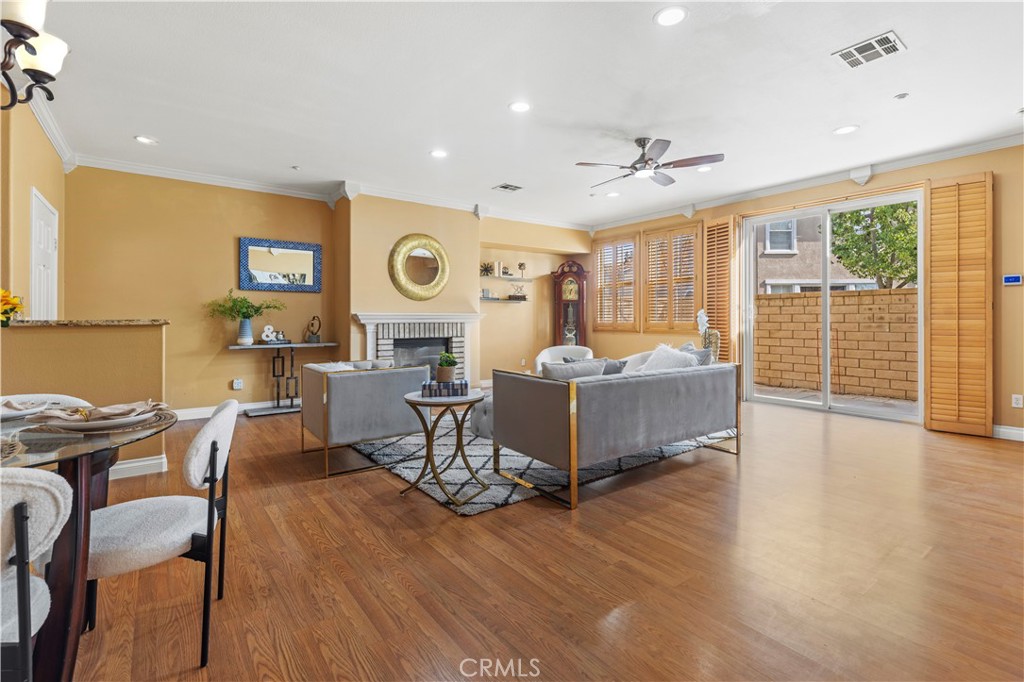 11450 Church Street, Unit 23 Rancho Cucamonga, CA 91730 - Photo 10 of 44 a view of a dining room with furniture window and wooden floor