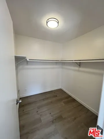 a view of an empty walk in closet