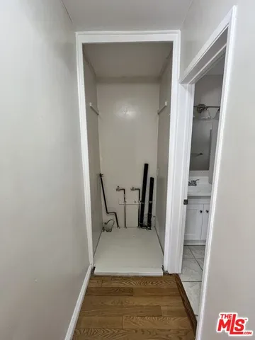 a view of bathroom with a sink and mirror