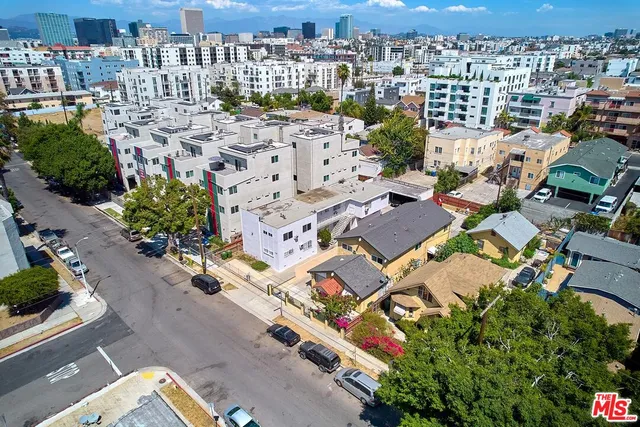 an aerial view of a city with lots of residential buildings