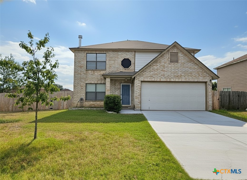 307 Stone Point New Braunfels, TX 78130 - Photo 1 of 1 a front view of a house with a yard and garage