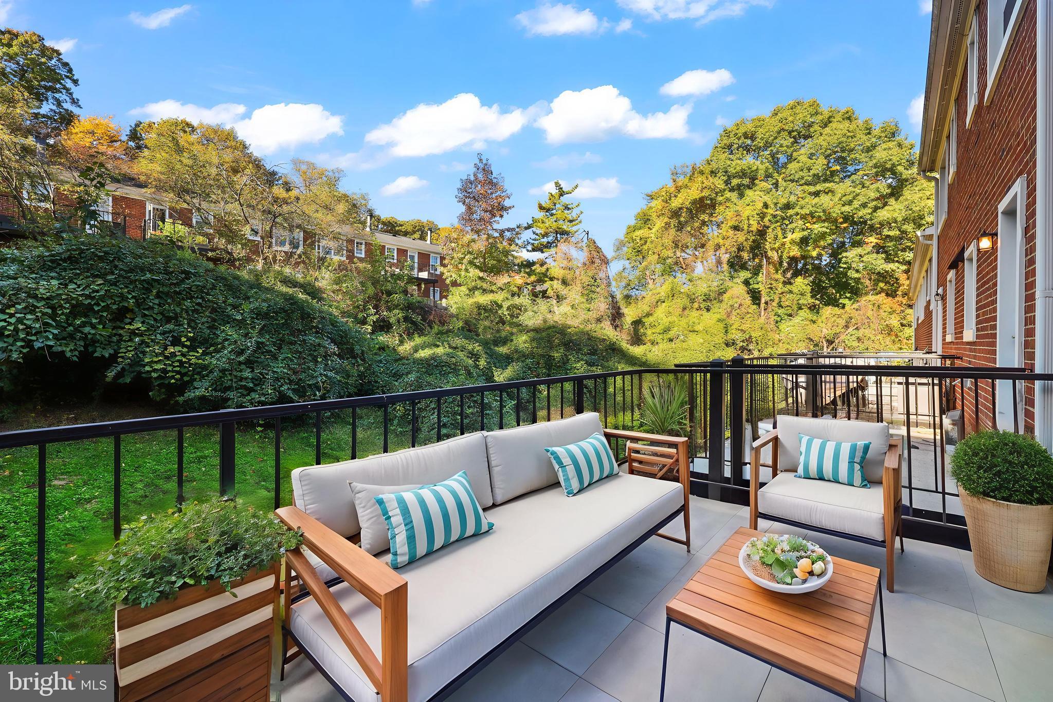 4619 28th Road South, Unit C Arlington, VA 22206 - Photo 21 of 31 a view of a balcony with couches and wooden floor