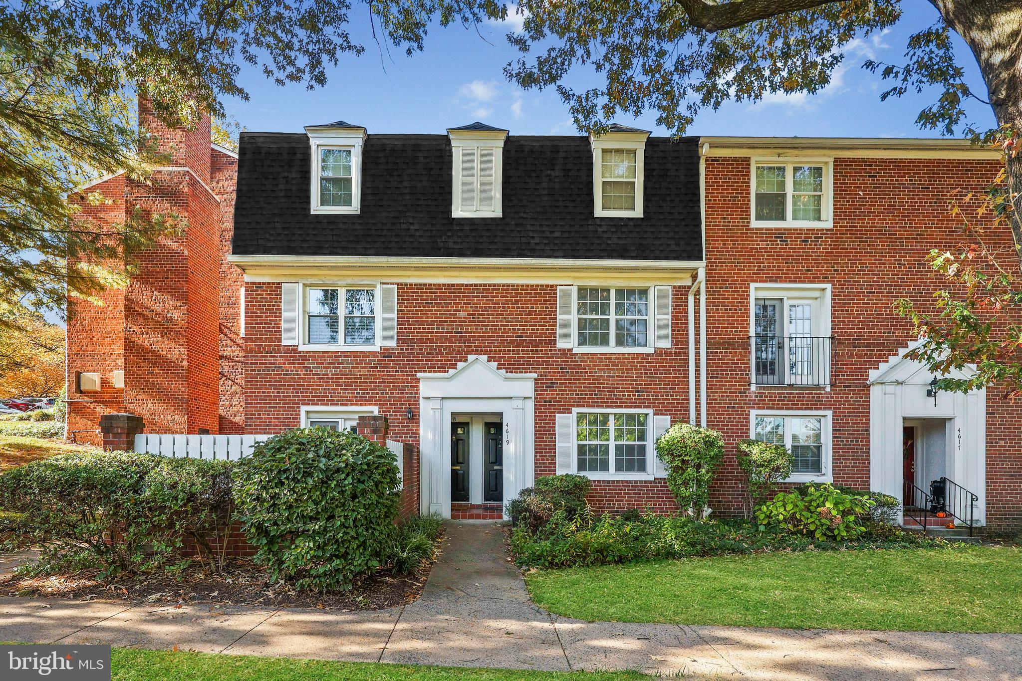 4619 28th Road South, Unit C Arlington, VA 22206 - Photo 27 of 31 front view of a brick house with a yard