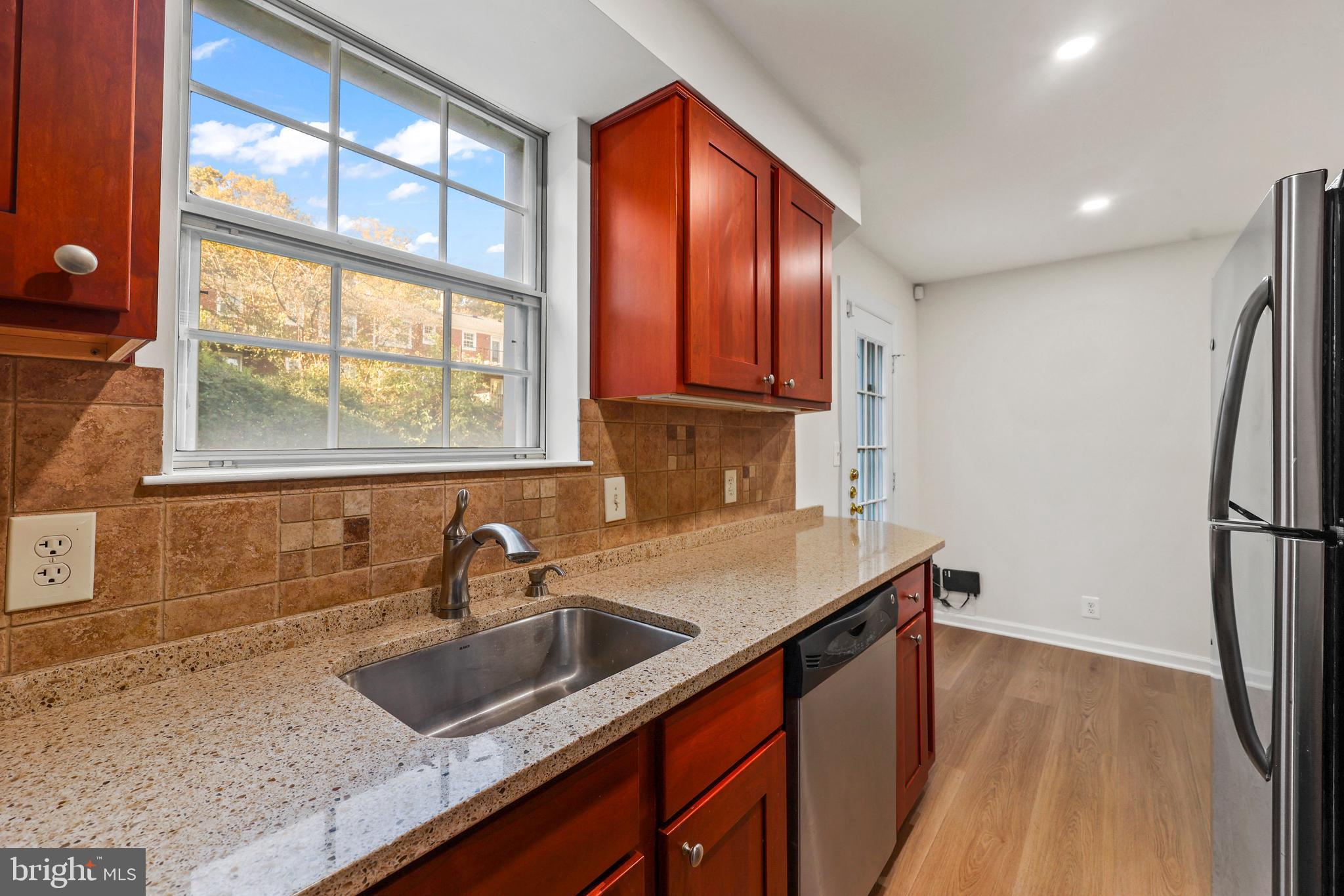 4619 28th Road South, Unit C Arlington, VA 22206 - Photo 3 of 31 a kitchen that has a sink a refrigerator and window