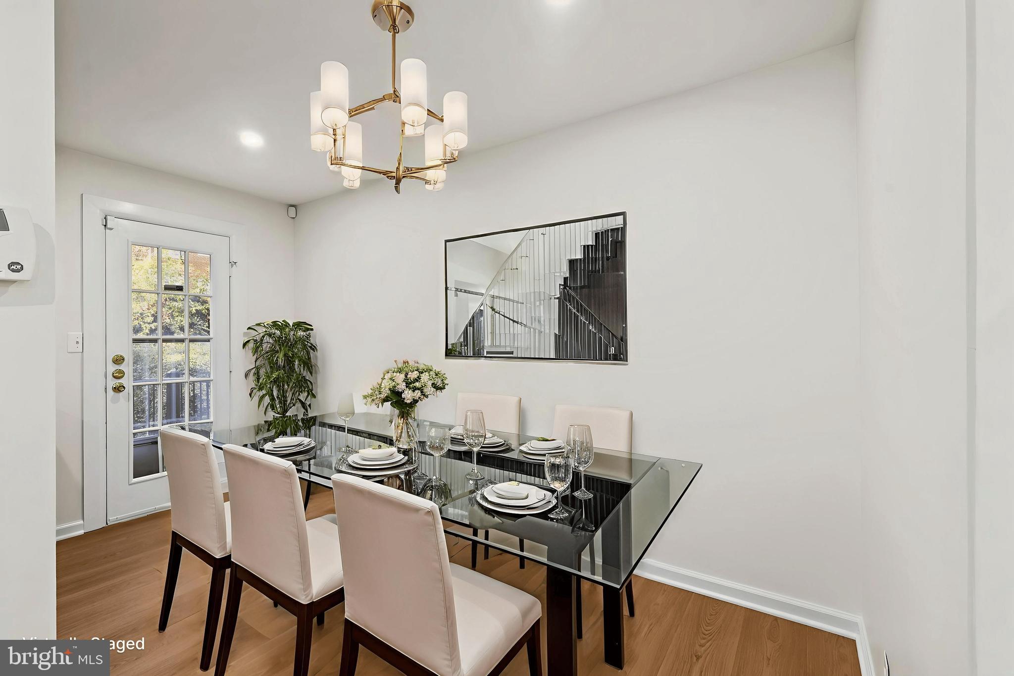 4619 28th Road South, Unit C Arlington, VA 22206 - Photo 4 of 31 a view of a dining room with furniture and chandelier