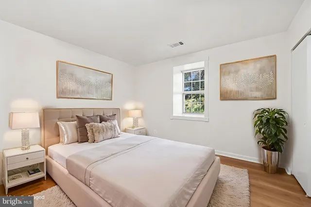 a bedroom with bed and a window