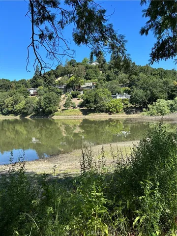 a view of a lake with a yard