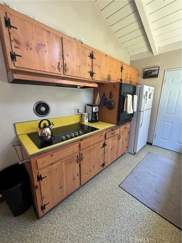 a kitchen with stainless steel appliances granite countertop a sink a stove and cabinets