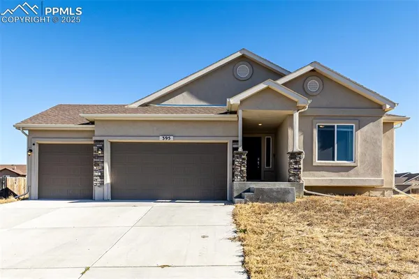 a front view of a house with a garage