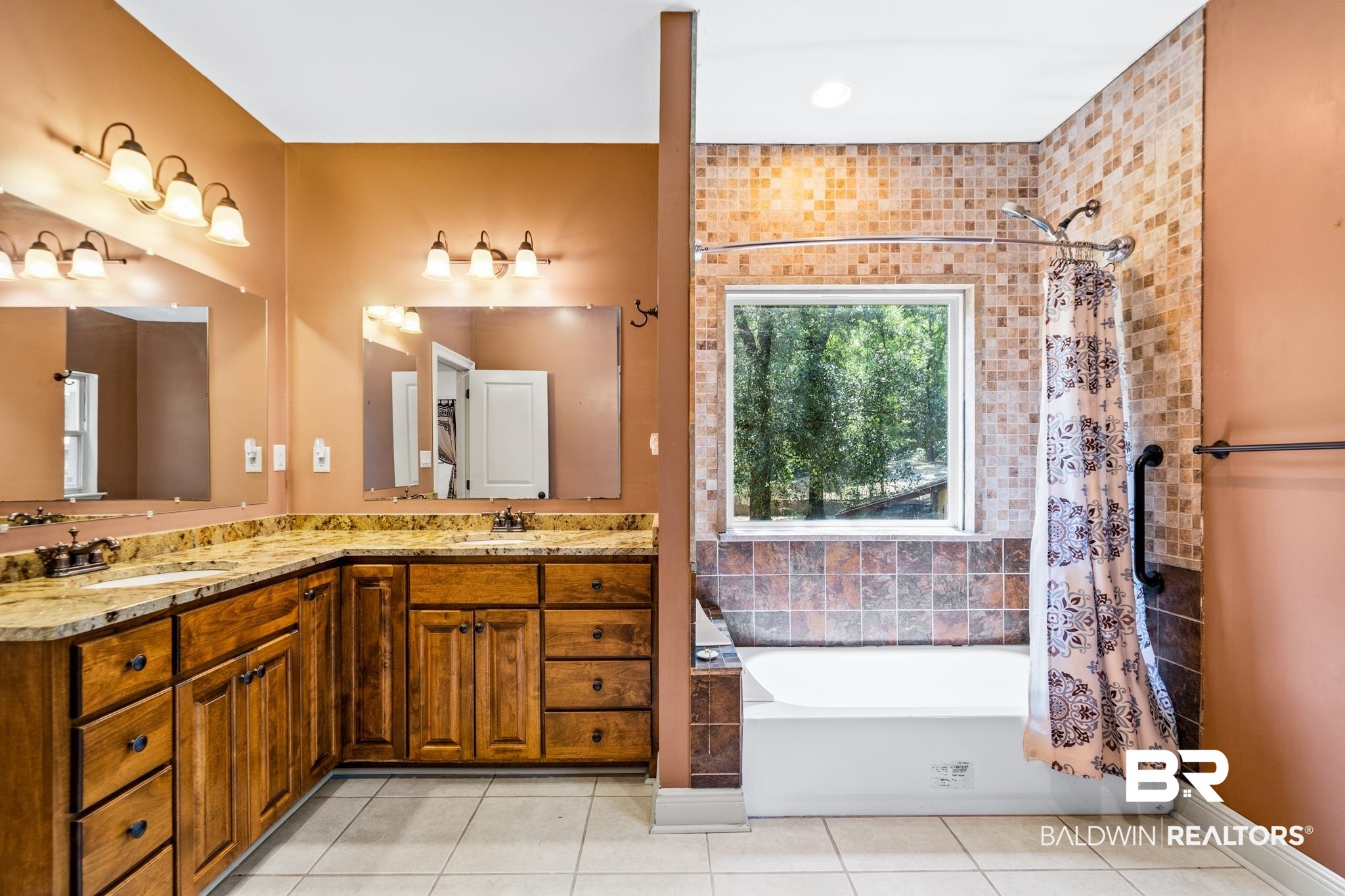 8321 Dixon Road Bay Minette, AL 36507 - Photo 43 of 79 Bathroom with dual bowl vanity and tile patterned flooring