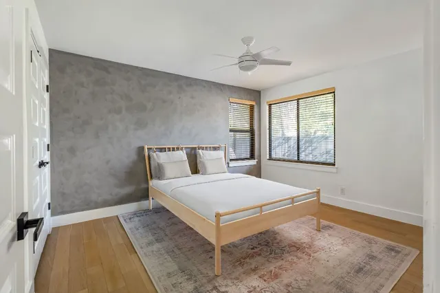 a bedroom with a bed and window