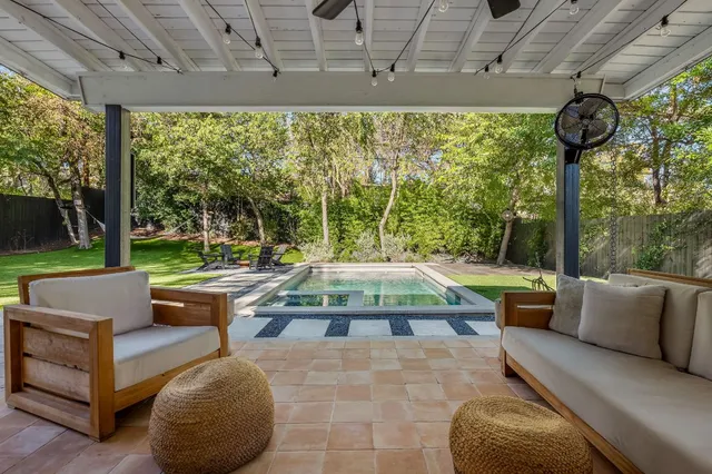 a outdoor space with patio the couches and a dining table with garden view