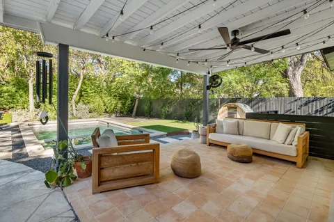 a outdoor space with patio the couches and dining table with the garden view