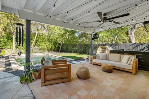 a outdoor space with patio the couches and dining table with the garden view