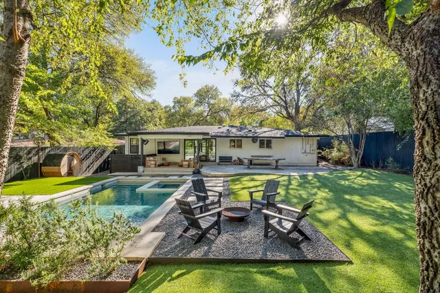 a view of a swimming pool with a patio