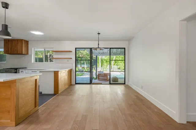 a view of a kitchen with a sink and a window