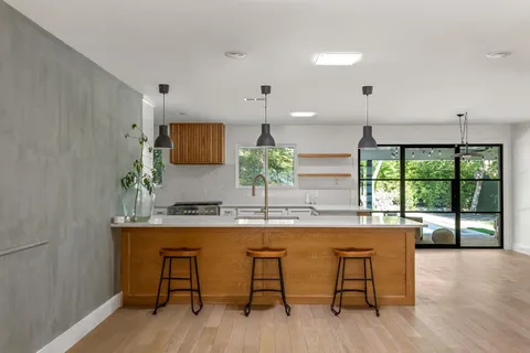a kitchen with a table and chairs in it