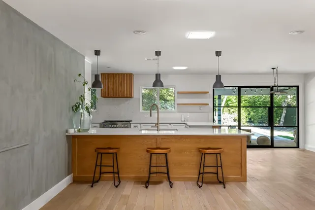 a kitchen with a table and chairs in it