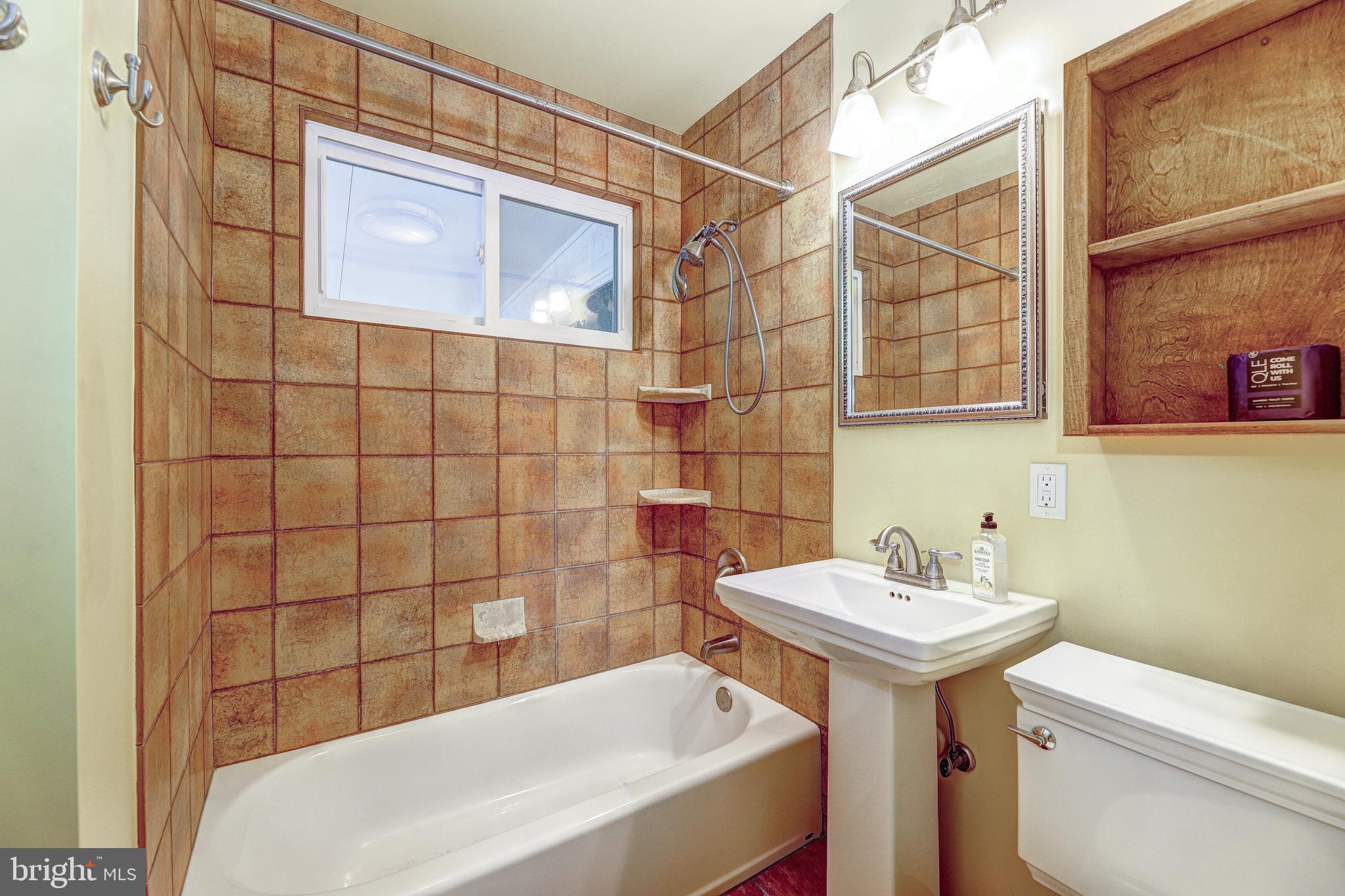 7500 Rocksham Drive Towson, MD 21286 - Photo 12 of 26 a bathroom with a sink a toilet and shower