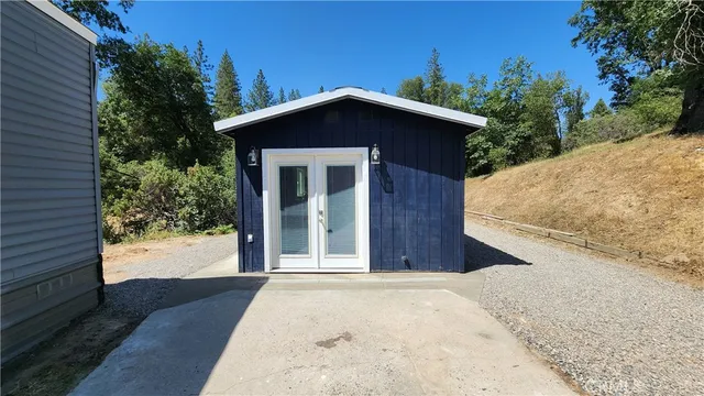 a view of a house with a wooden fence