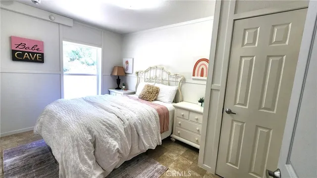 a view of a field with trees in the background