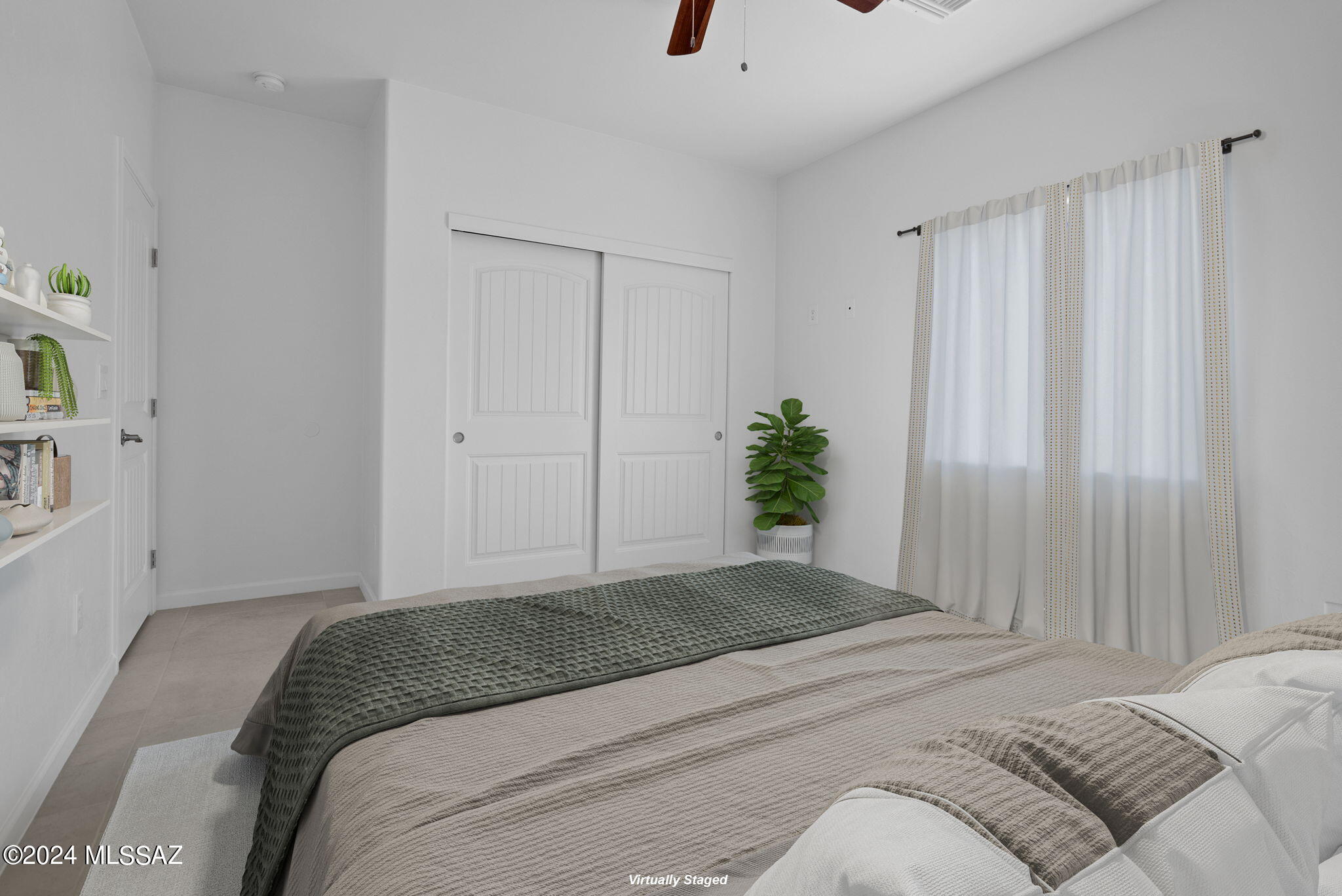 1835 America Court Rio Rico, AZ 85648 - Photo 18 of 35 a bedroom with a bed and a window