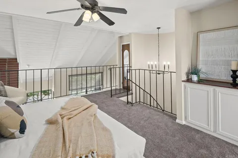 a bed room with a bed and a chandelier