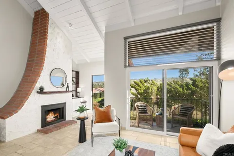 a view of a livingroom with furniture and fireplace