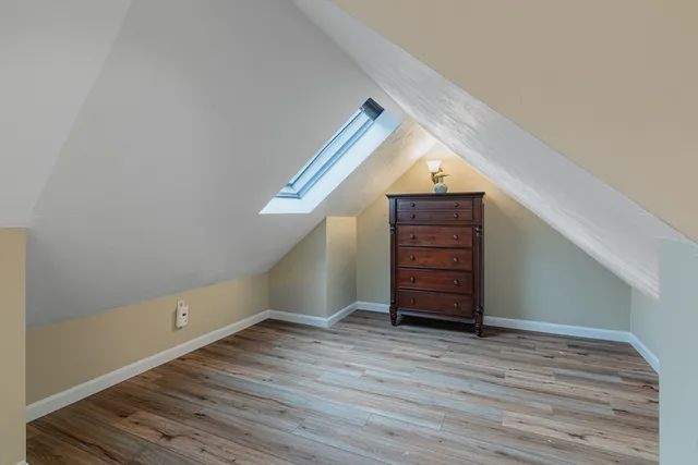 a view of room with wooden floor