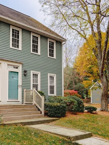 a front view of a house with garage