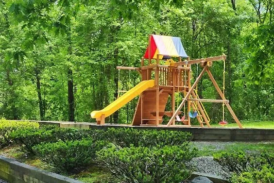 a view of a backyard with swimming pool