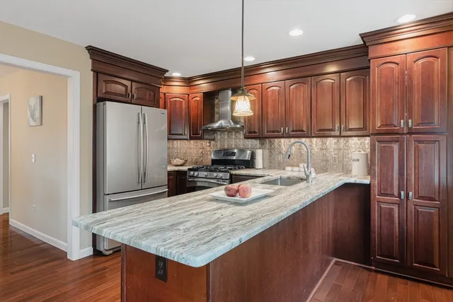 a kitchen with a refrigerator and countertop