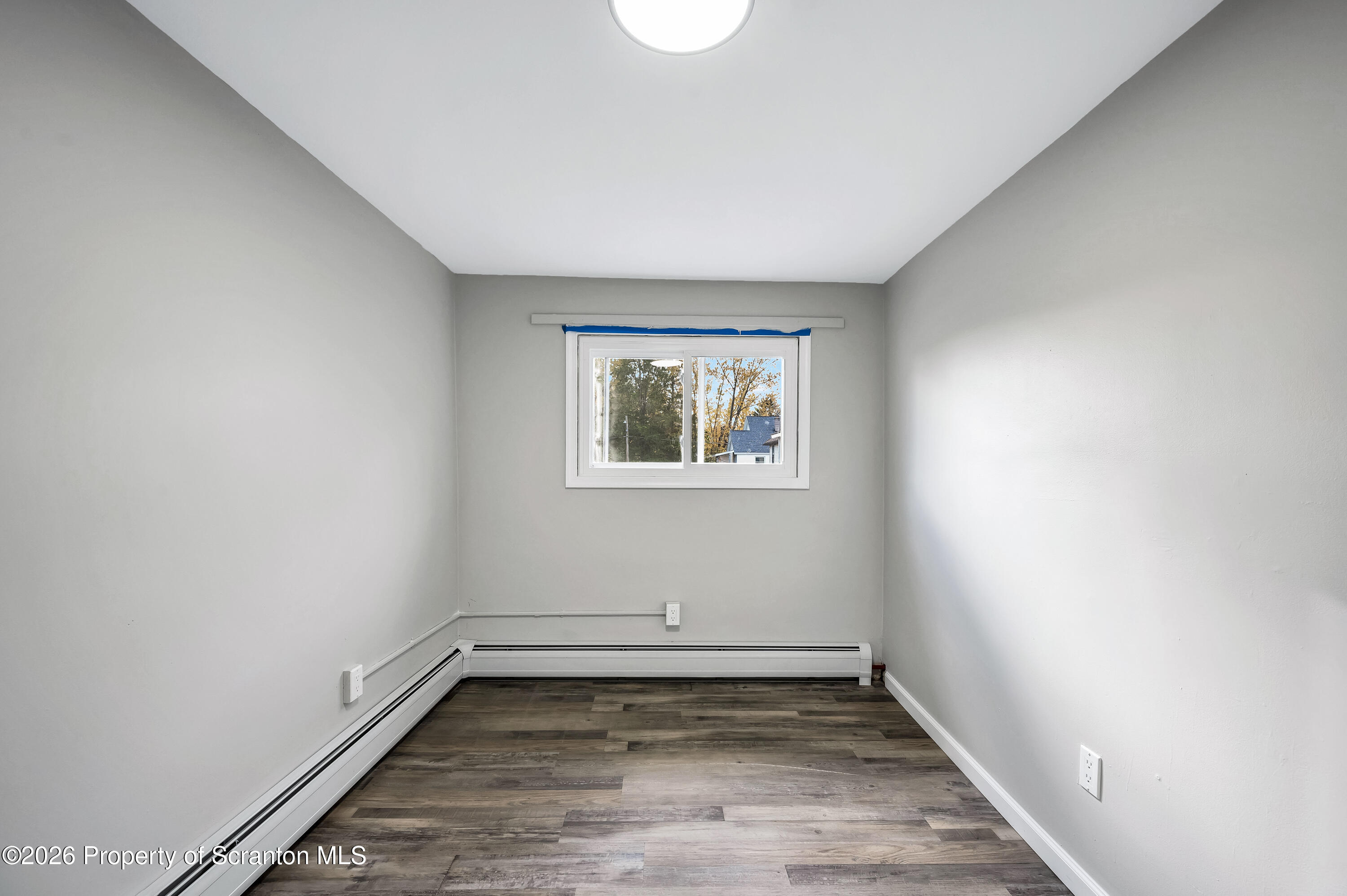 333 Oak Street, Unit 1/2 Scranton, PA 18508 - Photo 11 of 11 a view of a room with wooden floor and window