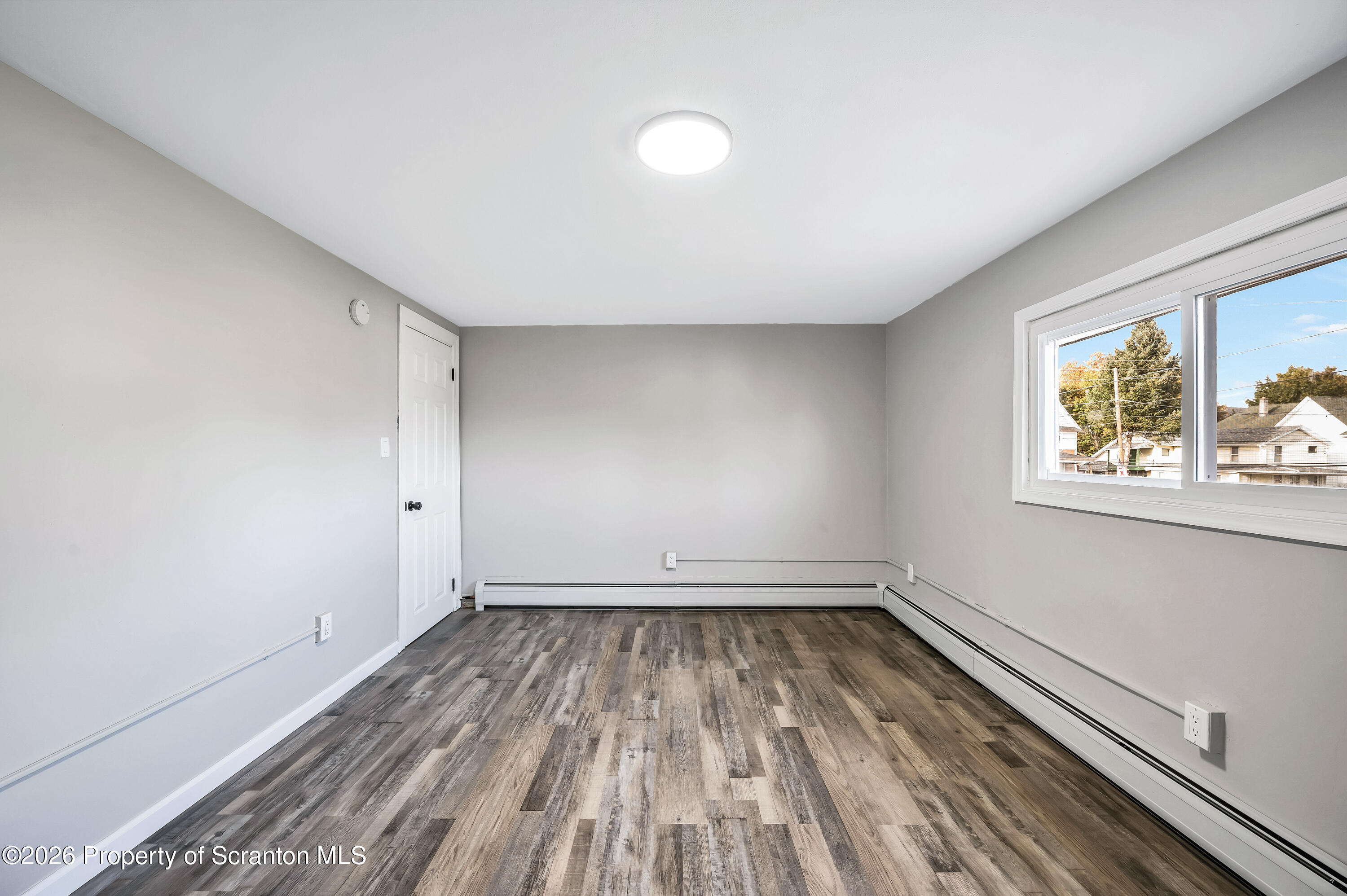 333 Oak Street, Unit 1/2 Scranton, PA 18508 - Photo 7 of 11 a view of room with window and wooden floor